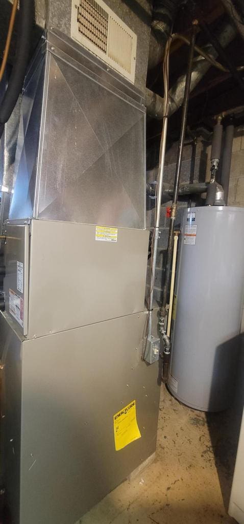 4141 W Cherrywood Ln, Brown Deer, WI 53209 - utilities featuring heating unit, visible vents, and gas water heater