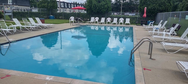 4141 W Cherrywood Ln, Brown Deer, WI 53209 - pool with a patio and fence