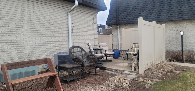 4141 W Cherrywood Ln, Brown Deer, WI 53209 - view of patio / terrace with central AC unit and fence