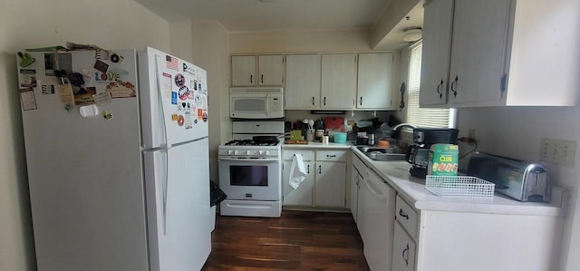 4141 W Cherrywood Ln, Brown Deer, WI 53209 - kitchen with white appliances, dark wood-style floors, light countertops, and a sink