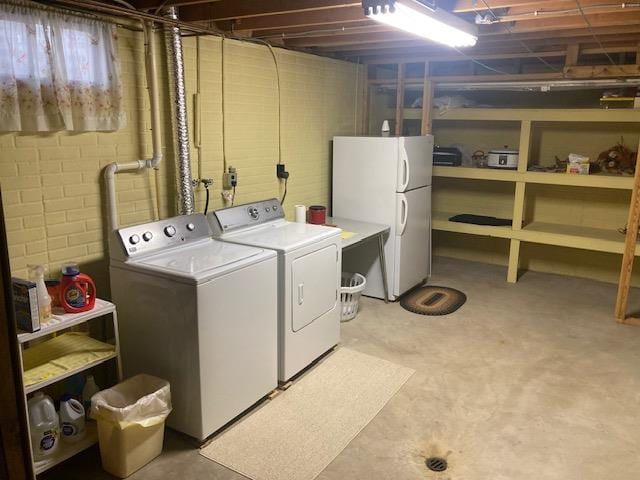 laundry room with washer and dryer and laundry area