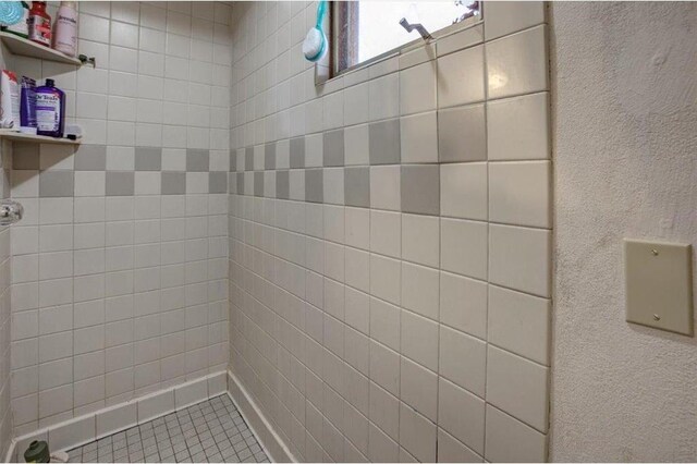 607 Cross Ave, Amery, WI 54001 - bathroom with a tile shower and tile patterned floors