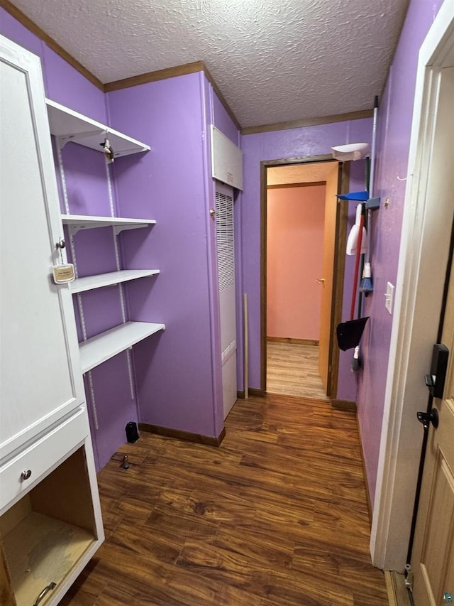 68485 N George St, Iron River, WI 54847 - laundry area with dark wood finished floors and a textured ceiling