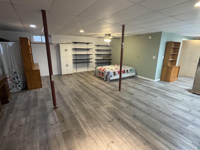 68485 N George St, Iron River, WI 54847 - bedroom featuring a drop ceiling, baseboards, and wood finished floors