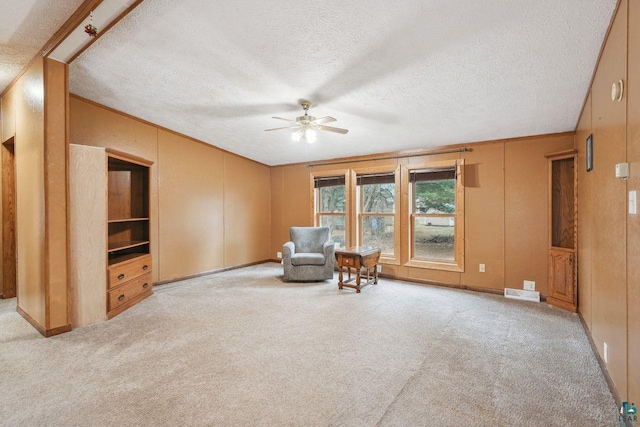 68485 N George St, Iron River, WI 54847 - sitting room featuring carpet floors, ceiling fan, a textured ceiling, baseboards, and a decorative wall