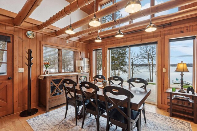 W9160 Ripley Rd, Cambridge, WI 53523 - dining area with wood walls, light wood-style floors, and beam ceiling