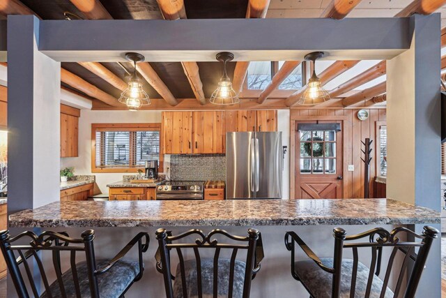 W9160 Ripley Rd, Cambridge, WI 53523 - kitchen with stainless steel appliances, a kitchen breakfast bar, beam ceiling, and wood ceiling