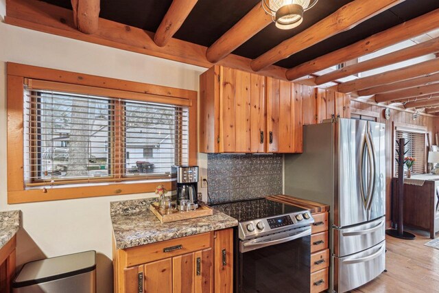 W9160 Ripley Rd, Cambridge, WI 53523 - kitchen featuring brown cabinets, beamed ceiling, light wood finished floors, stainless steel appliances, and backsplash