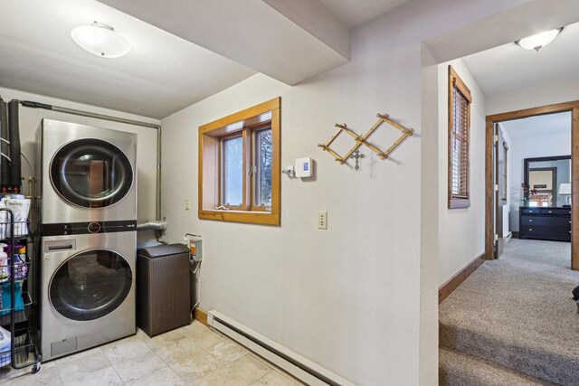 W9160 Ripley Rd, Cambridge, WI 53523 - laundry room with a baseboard heating unit, laundry area, baseboards, and stacked washer and clothes dryer