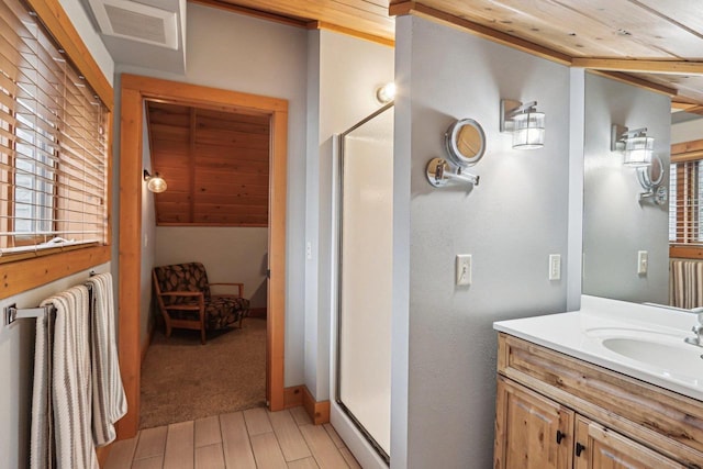 W9160 Ripley Rd, Cambridge, WI 53523 - full bath featuring vanity, a stall shower, visible vents, wooden ceiling, and wood finished floors