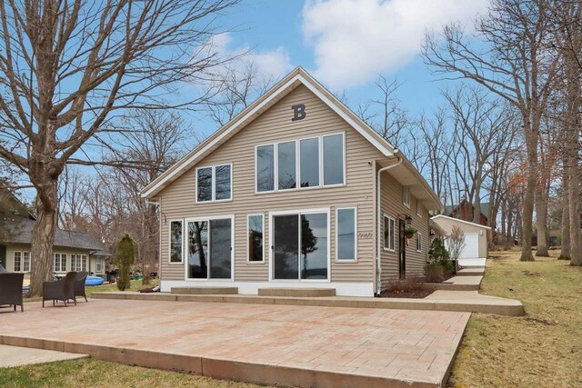 W9160 Ripley Rd, Cambridge, WI 53523 - back of house featuring a patio area, entry steps, and an outbuilding