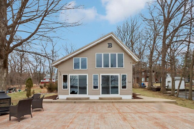 W9160 Ripley Rd, Cambridge, WI 53523 - rear view of property featuring a patio and entry steps