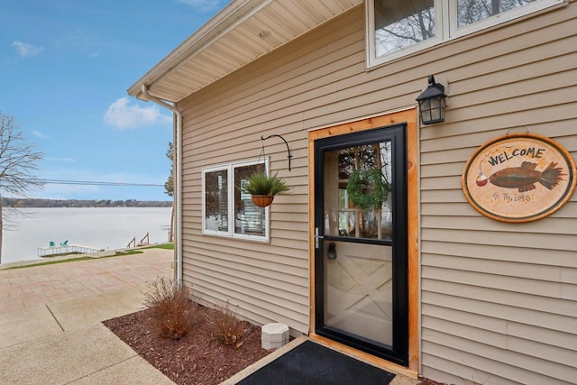 W9160 Ripley Rd, Cambridge, WI 53523 - doorway to property featuring a water view
