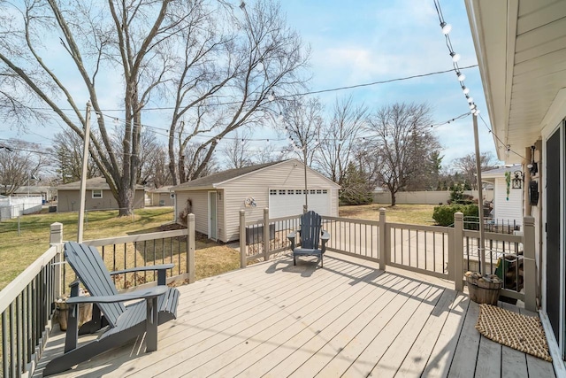 1501 Walls St, Green Bay, WI 54304 - wooden deck with a detached garage, an outdoor structure, and a yard