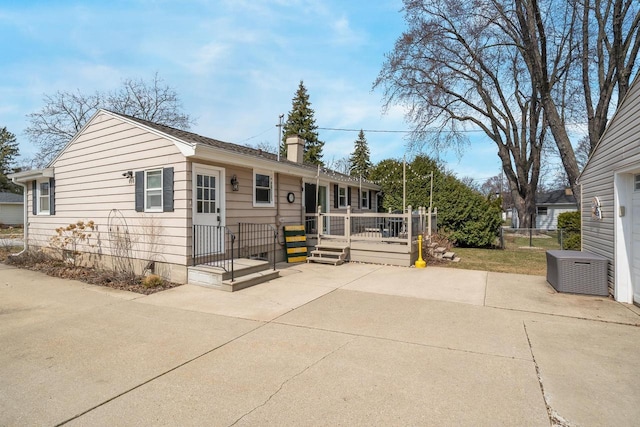1501 Walls St, Green Bay, WI 54304 - ranch-style house featuring a patio, a chimney, and a deck