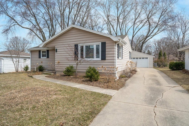 1501 Walls St, Green Bay, WI 54304 - bungalow-style house featuring a garage, a front yard, and an outbuilding