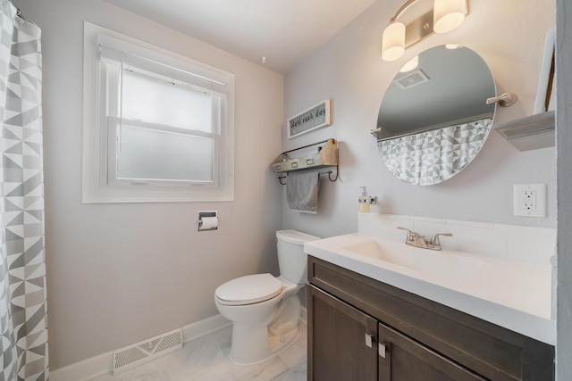1501 Walls St, Green Bay, WI 54304 - bathroom with toilet, baseboards, vanity, marble look tiles, and a shower with shower curtain