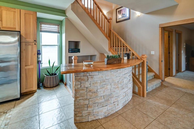 446 County Road Bb, Marshall, WI 53559 - interior space with stainless steel refrigerator, light tile patterned floors, and stairway