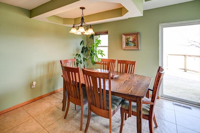 446 County Road Bb, Marshall, WI 53559 - dining space featuring a notable chandelier, baseboards, light tile patterned floors, visible vents, and a tray ceiling