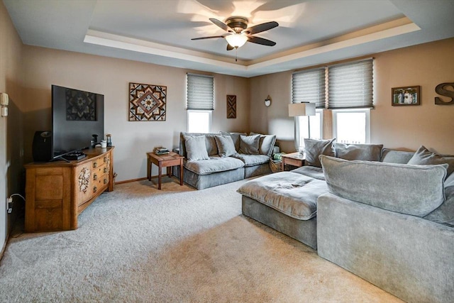 446 County Road Bb, Marshall, WI 53559 - carpeted living room with baseboards, a raised ceiling, and a ceiling fan
