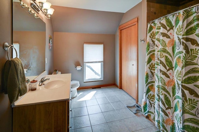 446 County Road Bb, Marshall, WI 53559 - full bathroom with an inviting chandelier, vanity, tile patterned flooring, vaulted ceiling, and toilet