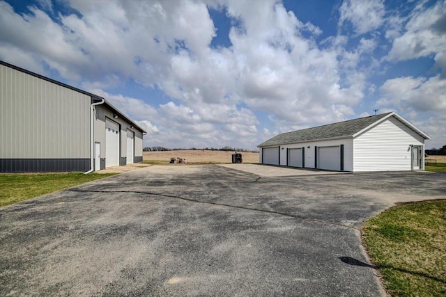 446 County Road Bb, Marshall, WI 53559 - exterior space with a garage and an outbuilding