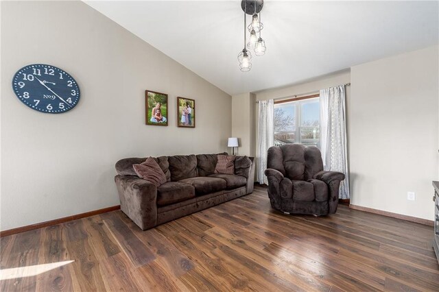 306 Dunn St, Colfax, WI 54730 - living area with baseboards, wood finished floors, and vaulted ceiling