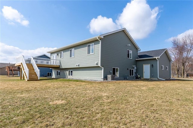 306 Dunn St, Colfax, WI 54730 - back of house featuring central AC, a deck, a lawn, and stairs