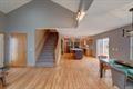 1359 Dianne Ave, Belleville, WI 53508 - game room featuring wood finished floors and lofted ceiling