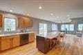 1359 Dianne Ave, Belleville, WI 53508 - kitchen featuring recessed lighting, light wood-style floors, light countertops, and brown cabinetry