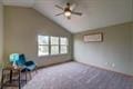1359 Dianne Ave, Belleville, WI 53508 - interior space with a wall mounted AC, carpet flooring, and vaulted ceiling