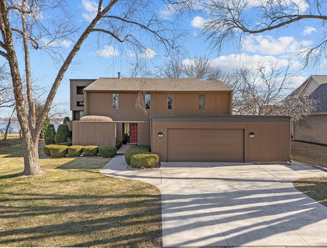 2136 White Swan Dr, Oshkosh, WI 54901 - view of front facade featuring concrete driveway and a front yard