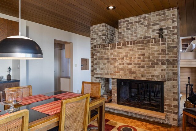 2136 White Swan Dr, Oshkosh, WI 54901 - dining space with recessed lighting, a fireplace, and wood ceiling