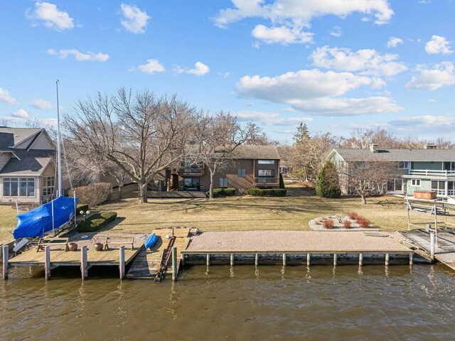 2136 White Swan Dr, Oshkosh, WI 54901 - view of dock with a lawn and a water view