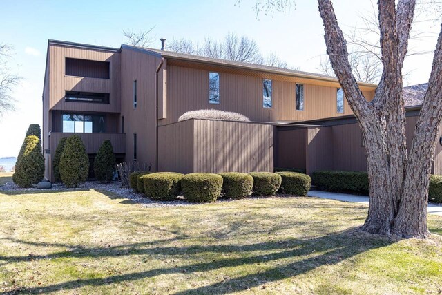 2136 White Swan Dr, Oshkosh, WI 54901 - exterior space with a front yard