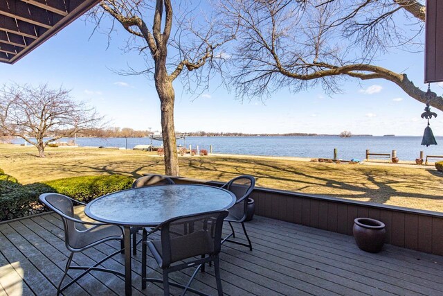 2136 White Swan Dr, Oshkosh, WI 54901 - deck featuring a water view and outdoor dining space