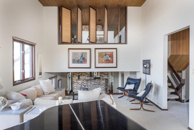 2136 White Swan Dr, Oshkosh, WI 54901 - living area with wooden ceiling, a towering ceiling, carpet, and stairs