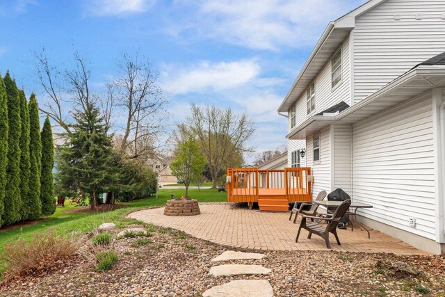911 Chalfont Dr, Sun Prairie, WI 53590 - view of yard with a fire pit, a deck, and a patio area