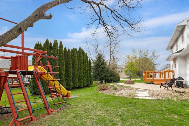 911 Chalfont Dr, Sun Prairie, WI 53590 - view of yard featuring a wooden deck and a playground