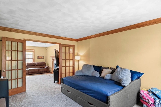 911 Chalfont Dr, Sun Prairie, WI 53590 - carpeted living area with ornamental molding and french doors