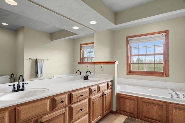 911 Chalfont Dr, Sun Prairie, WI 53590 - full bathroom with double vanity, recessed lighting, a sink, and a bath