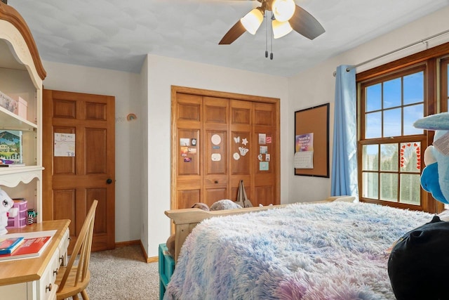 911 Chalfont Dr, Sun Prairie, WI 53590 - carpeted bedroom with a ceiling fan, baseboards, and a closet