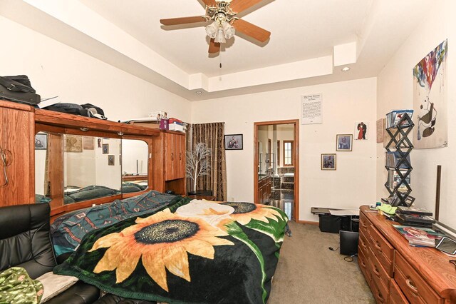 2421 Dover Ln, Mount Pleasant, WI 53406 - bedroom with a tray ceiling, baseboards, light colored carpet, and ceiling fan