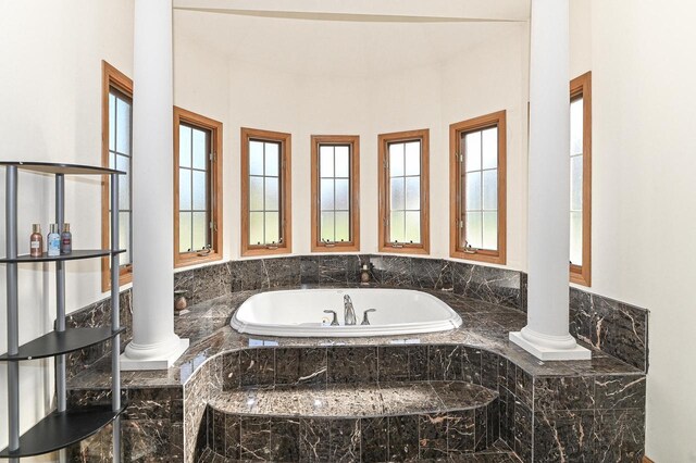 2421 Dover Ln, Mount Pleasant, WI 53406 - bathroom featuring a bath, a wealth of natural light, and decorative columns