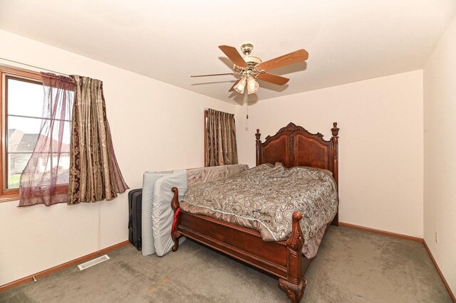 2421 Dover Ln, Mount Pleasant, WI 53406 - carpeted bedroom featuring baseboards, a ceiling fan, and visible vents