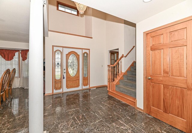 2421 Dover Ln, Mount Pleasant, WI 53406 - foyer entrance with plenty of natural light, stairs, marble finish floor, and baseboards