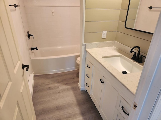 613 Saddle Rdg, Portage, WI 53901 - bathroom with toilet, vanity, wood finished floors, and  shower combination