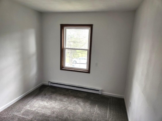 613 Saddle Rdg, Portage, WI 53901 - carpeted spare room featuring a baseboard radiator and baseboards