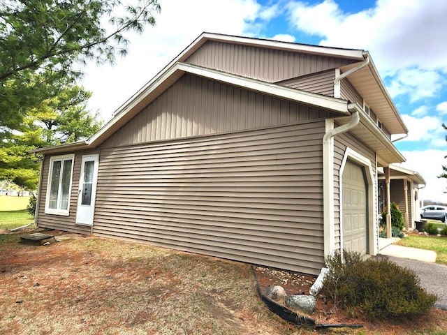 613 Saddle Rdg, Portage, WI 53901 - view of property exterior featuring a garage and driveway
