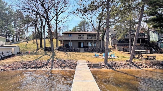 rear view of property with a deck with water view